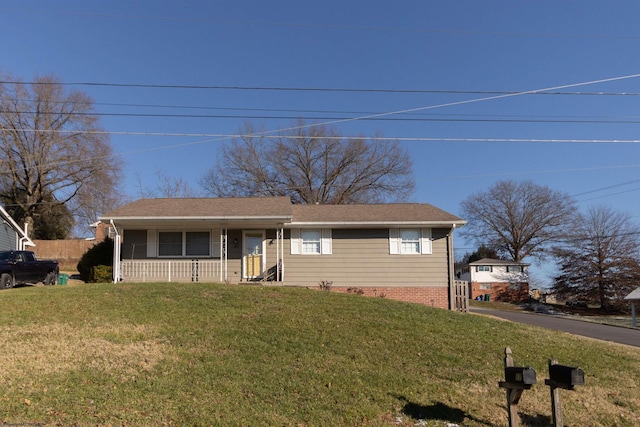 view of front of property featuring a porch and a front lawn