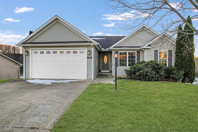 view of front of home featuring a front lawn and a garage