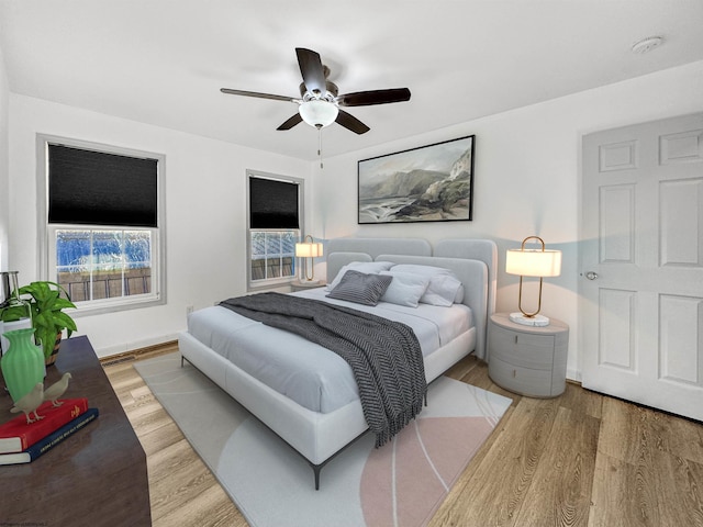 bedroom featuring hardwood / wood-style floors and ceiling fan