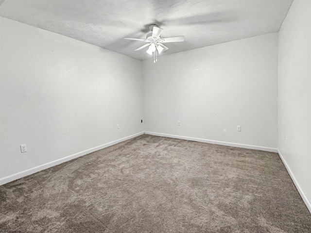 spare room with ceiling fan and carpet floors