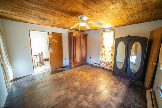 unfurnished bedroom with a baseboard radiator, ceiling fan, dark wood-type flooring, and wood ceiling