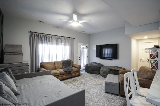 living room with ceiling fan