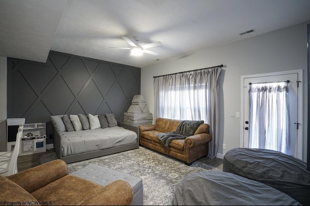 living room with ceiling fan and hardwood / wood-style flooring