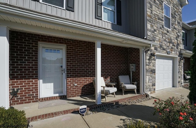 view of exterior entry with a garage