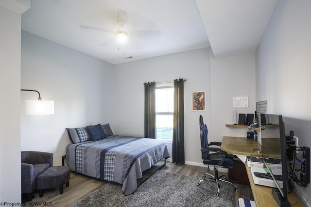 bedroom featuring ceiling fan and wood-type flooring