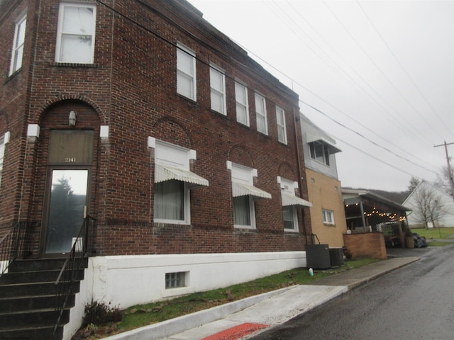 view of building exterior featuring central AC unit