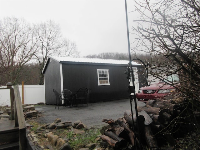 view of side of home with a patio