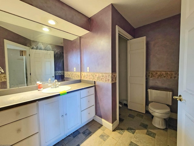 bathroom with vanity and toilet