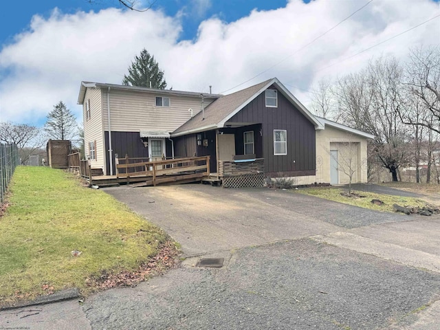 view of front of house with a front lawn and a deck