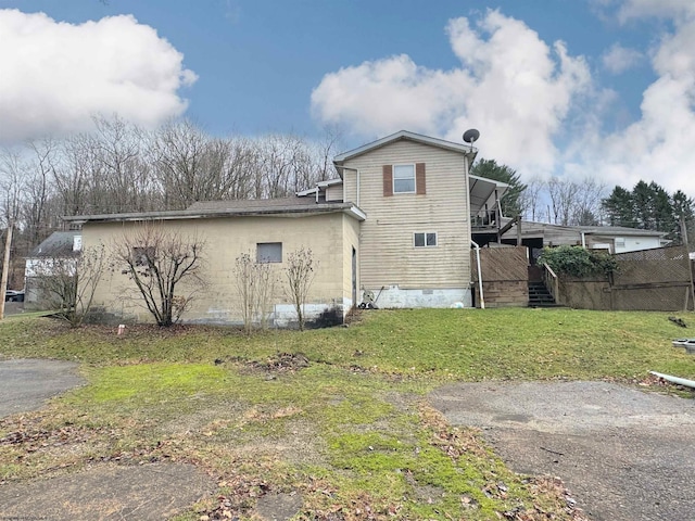 view of home's exterior with a yard