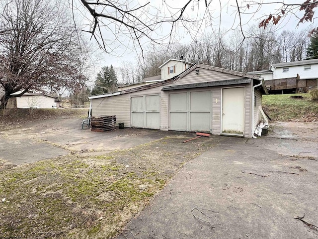 view of side of home with a garage