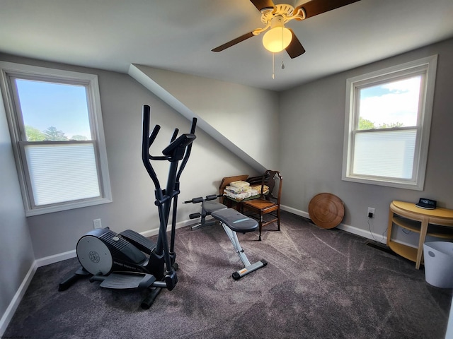 exercise area featuring dark colored carpet and ceiling fan