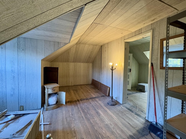 additional living space featuring hardwood / wood-style flooring, lofted ceiling, and wood ceiling