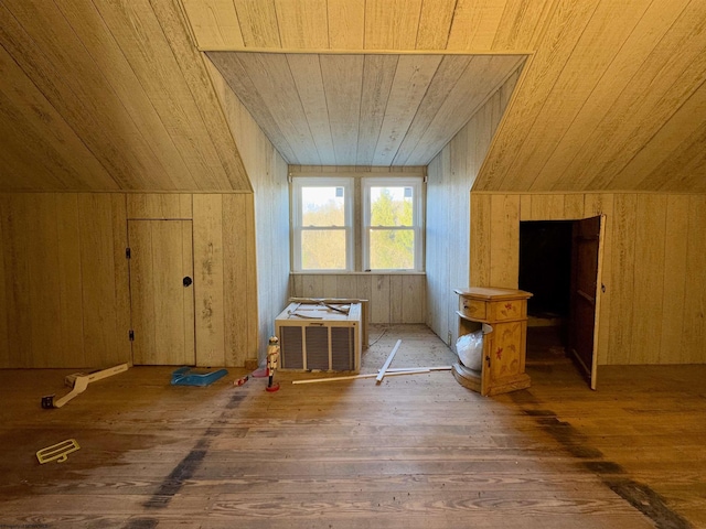 additional living space featuring dark hardwood / wood-style flooring, vaulted ceiling, and wooden ceiling