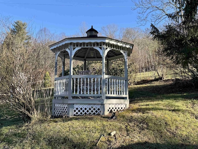 view of home's community with a lawn and a gazebo