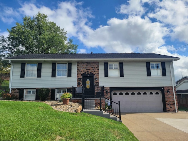 split foyer home with a front yard and a garage