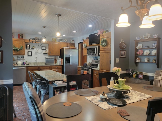 dining area with wood ceiling and sink