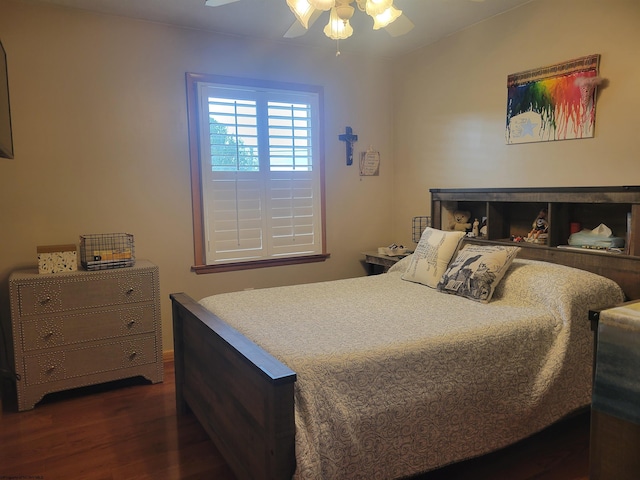 bedroom featuring ceiling fan and dark wood-type flooring