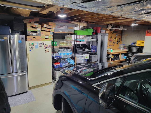 garage featuring stainless steel fridge