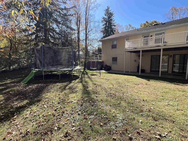 view of yard featuring a trampoline