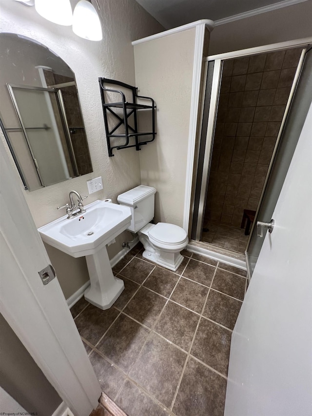 bathroom featuring tile patterned flooring, toilet, and a shower with shower door