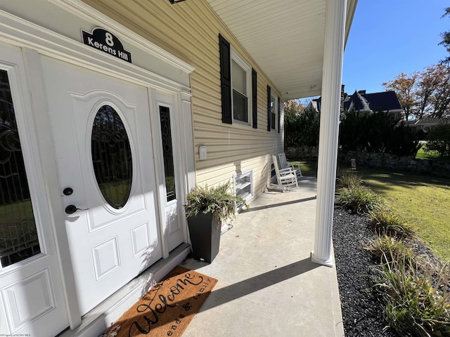 doorway to property with covered porch