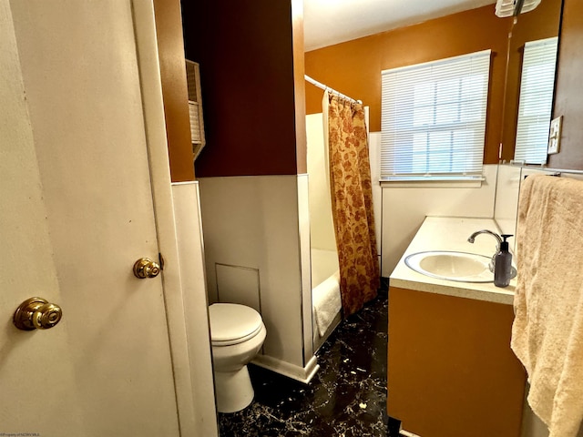 full bathroom featuring shower / bath combination with curtain, vanity, and toilet