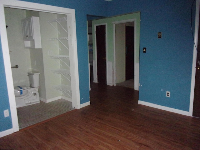 spare room featuring dark hardwood / wood-style floors