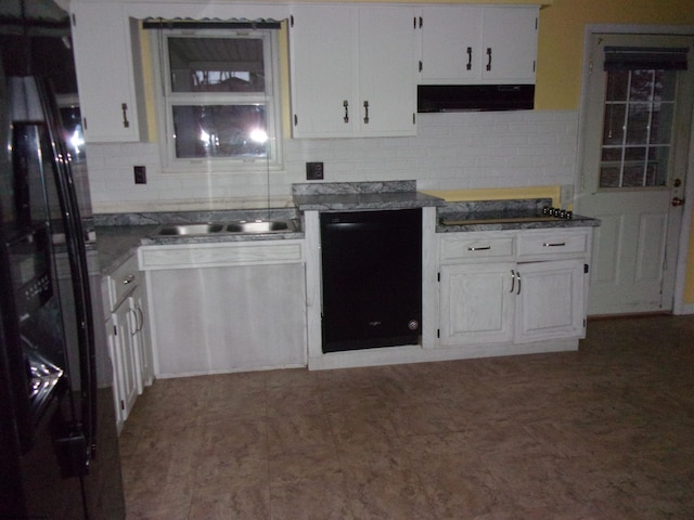 kitchen with decorative backsplash, extractor fan, sink, black appliances, and white cabinetry