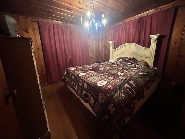 bedroom with wood ceiling and wooden walls