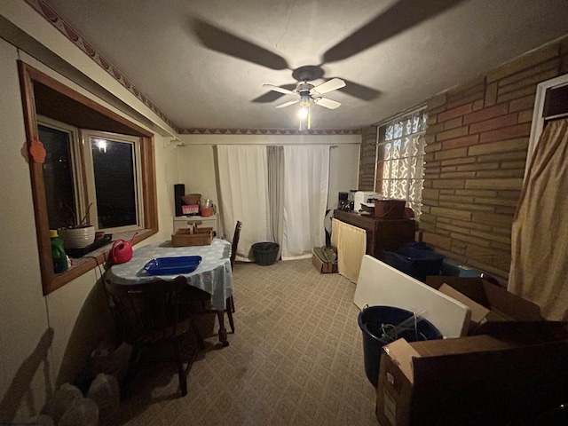 bedroom featuring ceiling fan and light carpet