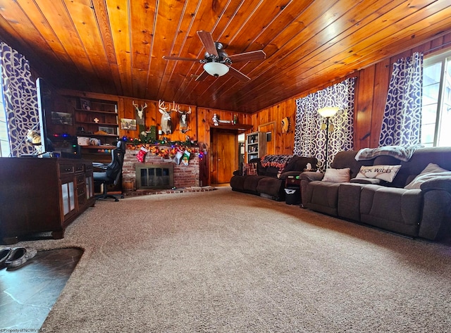 living room with carpet, wood walls, ceiling fan, and wooden ceiling