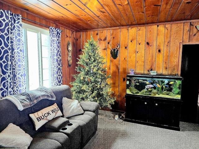 living room featuring carpet flooring, wood walls, and wooden ceiling