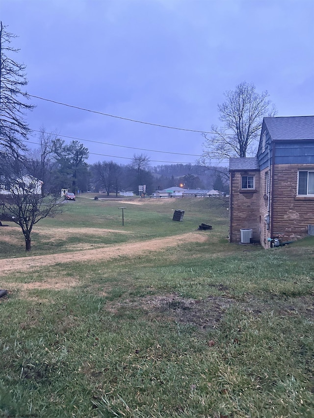 view of yard featuring central AC