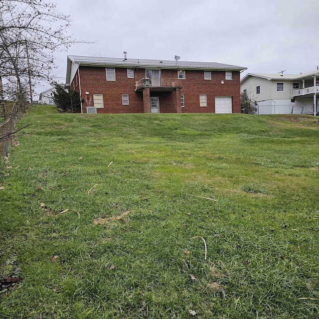 rear view of property with a yard