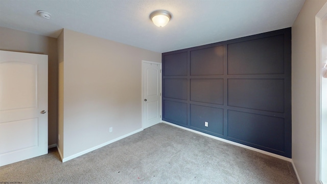 unfurnished bedroom with light carpet