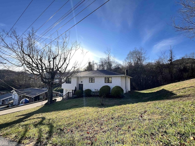 view of property exterior with a yard