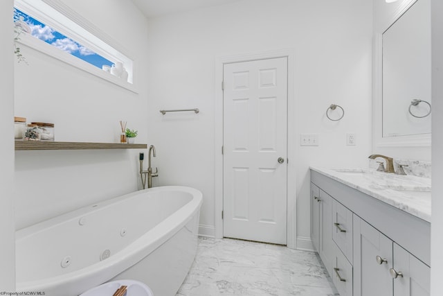 bathroom featuring vanity and a bath