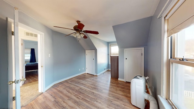 bonus room with ceiling fan, light wood-type flooring, and lofted ceiling