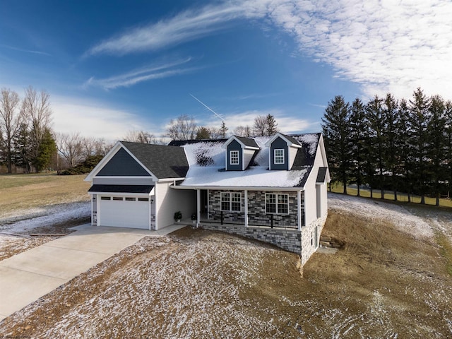 cape cod house with a garage