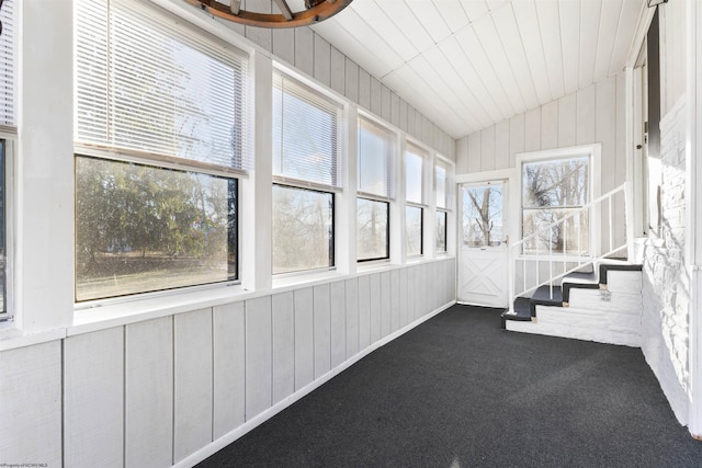 unfurnished sunroom with vaulted ceiling