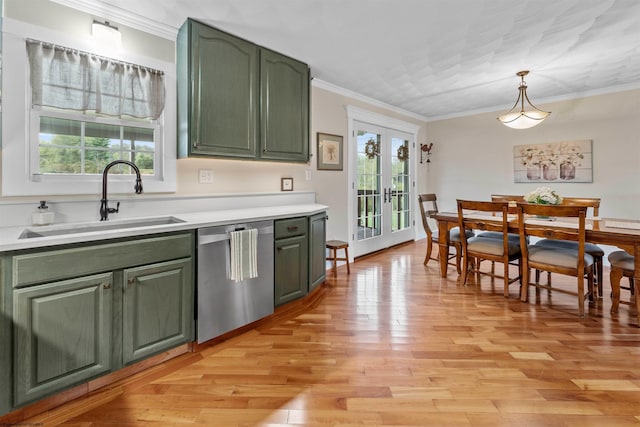 kitchen with pendant lighting, dishwasher, french doors, sink, and light wood-type flooring