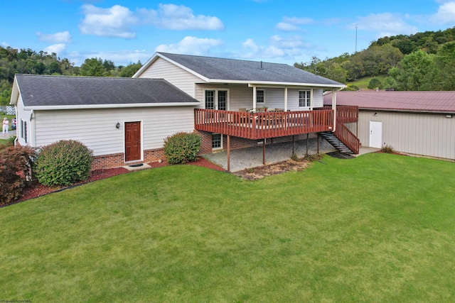 back of house featuring a yard and a wooden deck