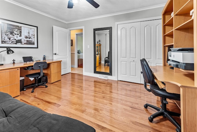 home office with ceiling fan, light hardwood / wood-style floors, and ornamental molding