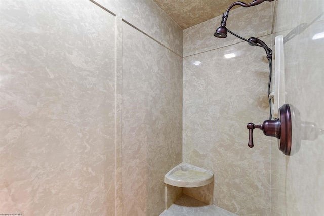 bathroom with tiled shower