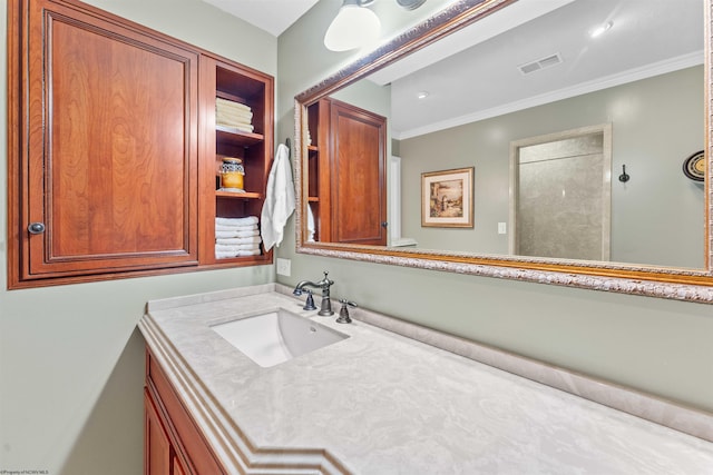 bathroom with vanity and ornamental molding