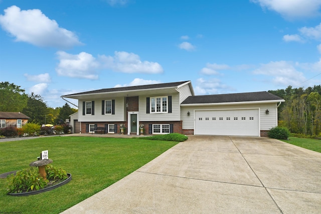 split foyer home featuring a garage and a front lawn