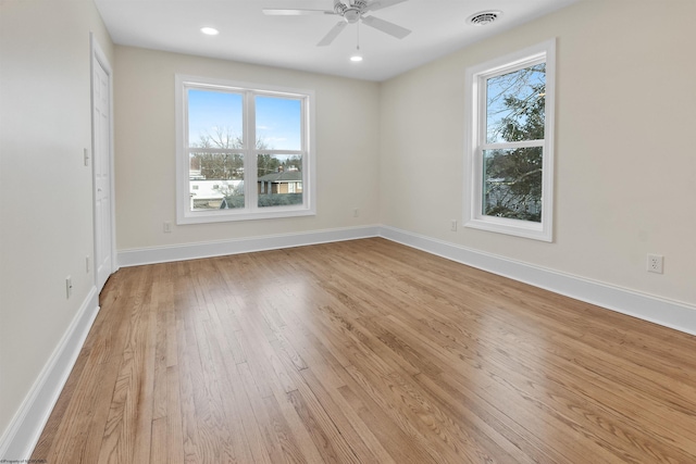 spare room featuring ceiling fan and light wood-type flooring