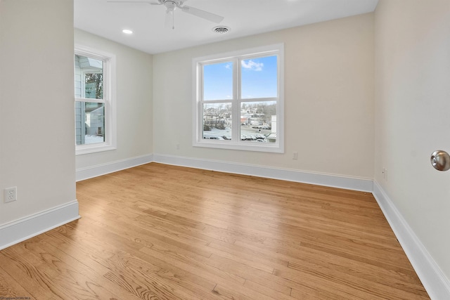 unfurnished room with ceiling fan and light hardwood / wood-style flooring