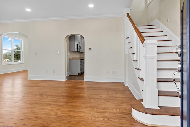 interior space featuring light hardwood / wood-style flooring and ornamental molding